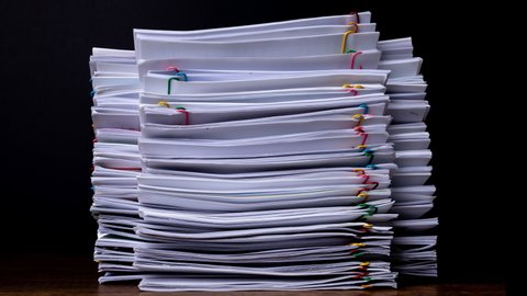 Stack overload document report paper with colorful paperclip place and copy space, bureaucracy business concept footage paperless used – 4K Stop motion.