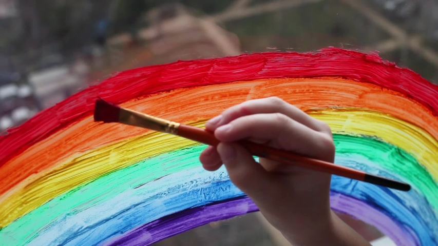 Painting rainbow during Covid-19 quarantine at home. Stay at home Social media campaign for coronavirus prevention, let's all be well, hope during coronavirus pandemic concept | Shutterstock HD Video #1051115467