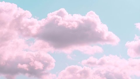 Motions clouds. Puffy fluffy beautiful pink clouds on turquise sky time lapse. Slow moving clouds. Pastel palette. Wonderful nature
