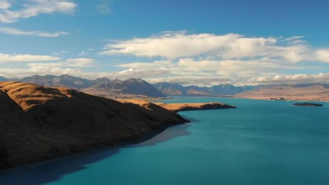 Lake Tekapo is in the South Island of New Zealand. It's fringed by the Southern Alps and known for its turquoise colour.