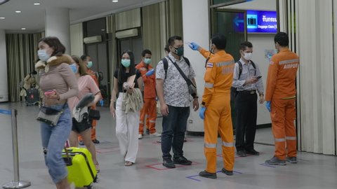 Bangkok, Thailand March 1 2020 Airport Security Workers Thermal Scanning Plane Passengers for Covid-19 Coronavirus Transportation Safety