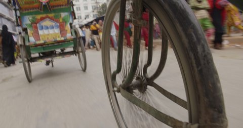 Rickshaw Tuk Tuk in Dhaka, Bangladesh. Local taxi drive in busy Asian street.