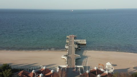 Drone shot on an empty pier on the beach of Gdansk in Poland, during the quarantine of the corono virus in April 2020.