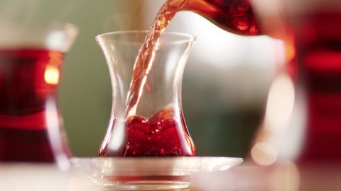 Slow motion.It fills Turkish tea into a glass special to the Turks.