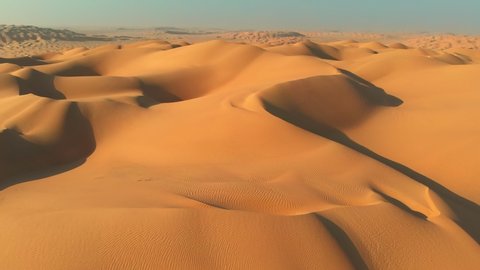 Rub' al Khali (Empty Quarter), Arabian Peninsula. Flying over sand dunes in desert. Camera moving rightwards. Aerial shot, UHD