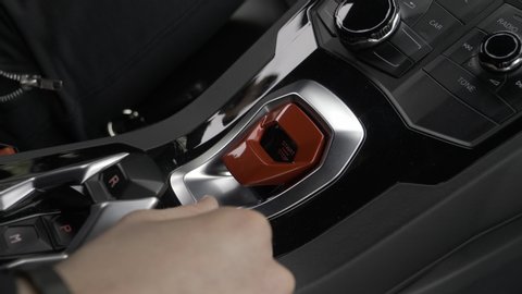 Press engine start button with security lock on a supercar
