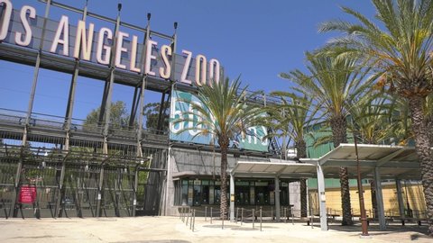 2020: Los Angeles USA, April 25. Public museums and zoos are closed in California due to the Coronavirus COVID-19 pandemic. Los Angeles LA Zoo main entrance closed gates and ticket line empty 