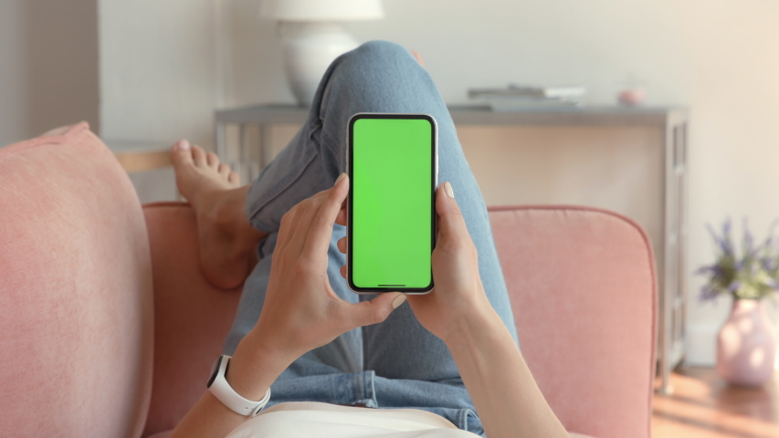 Phone with Green Screen and Chroma Key for Copy Space. Chromakey Mock Up with Tracking Markers and Alpha Matte. Concept of 20s Hipster with Modern Device. Scroll Up and Tap to Click on Centre Closeup Royalty-Free Stock Footage #1051199827