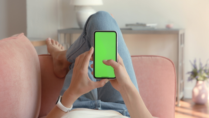 Phone with Green Screen and Chroma Key for Copy Space. Chromakey Mock Up with Tracking Markers and Alpha Matte. Concept of 20s Hipster with Modern Device. Scroll Up and Tap to Click on Centre Closeup | Shutterstock HD Video #1051199827