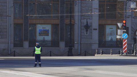 RUSSIA, ST. PETERSBURG - April 22, 2020. One traffic police officer patrol the streets and stop car drivers during quarantine of the coronavirus.
