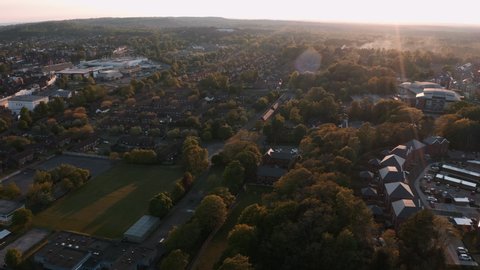 Aerial sunset view of a small town in Surrey, England during Isolation of Covid-19 in summer