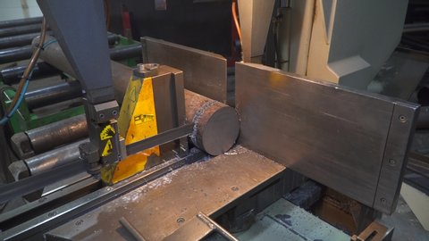 cutting a circular metal saw on a machine