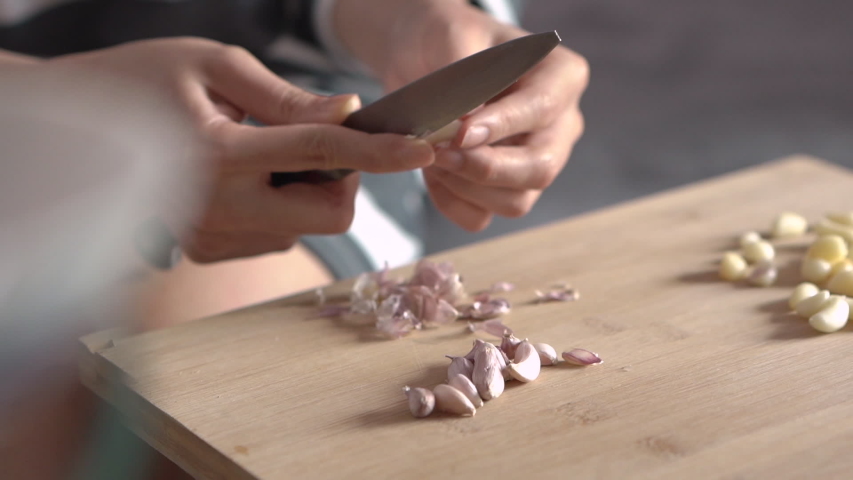 Hands Peeling Garlic with knife image - Free stock photo - Public ...