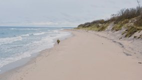 girl runs along the beach