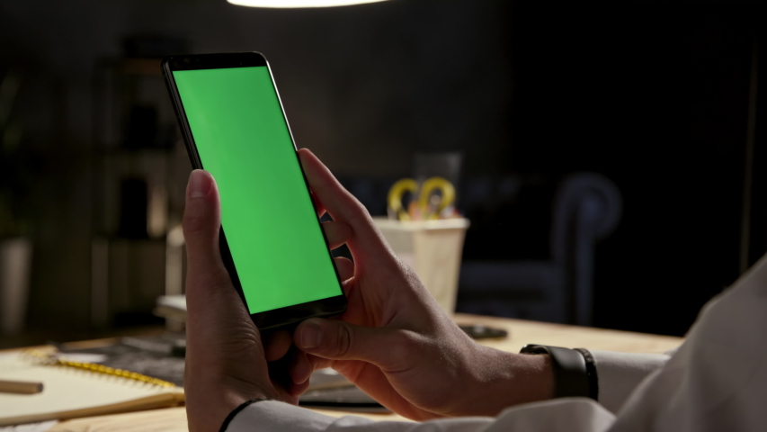 Green Screen and Chroma Key of Smartphone. Tap on Center to Click Closeup. Businessman Using Smart Phone for Work. Office Worker Connects to Chat or Video Conference. Greenscreen of Chromakey Mock-Up | Shutterstock HD Video #1051251382