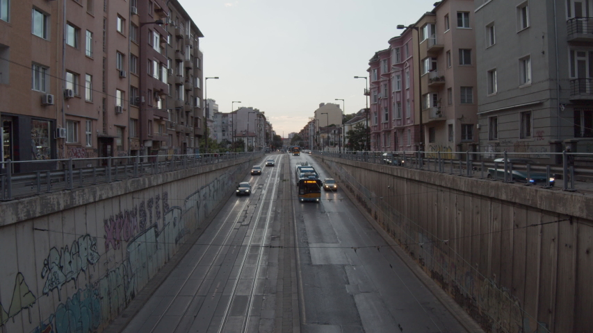 Trolley buses driving into city tunnel - urban transportation concept