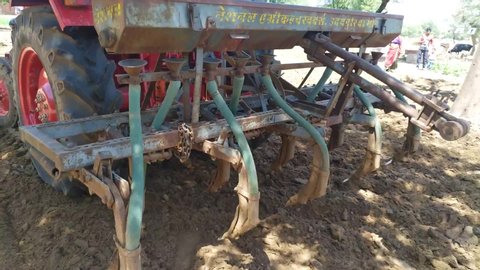 Chhilawali, Rajasthan / India - 25 April 2020: Tractor working at farm, farming with tractor.
