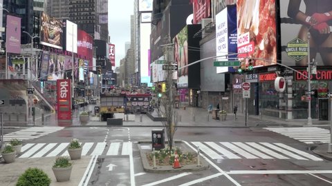 NEW YORK - APR 25, 2020: Times Square bucket truck and cone in desolate empty street with no people during coronavirus COVID-19 pandemic quarantine lockdown in Midtown Manhattan New York City NYC. 