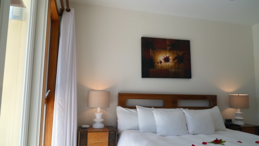 Interior of luxurious bedroom, bed at hotel room - Belize City, Belize