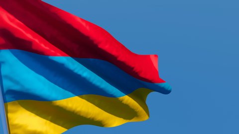 The national flag of Armenia is flying in the wind