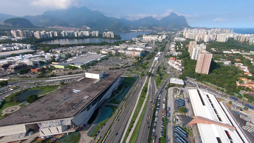 Rio De Janerio aerial view! Helicopter view of the Brazilian capital city. Town, streets, and buildings. Panoramic view of Brazil with famous beach background. Aerial cityscape.