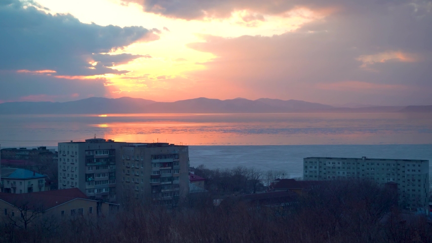 Beautiful sunset on the background of the city. Vladivostok, Russia