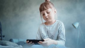education, school, technology and internet concept - little student girl with smartphone