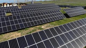 Drone flight over solar panel farm for production renewable green alternative power. Alternative energy source - Powered by Shutterstock - Get 15% off with code: PIKWIZARD15