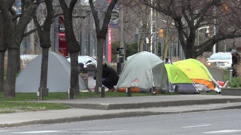 Toronto, Ontario, Canada April 2020 Homeless people sleep in tents on downtown street during COVID 19 pandemic