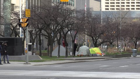 Toronto, Ontario, Canada April 2020 Homeless people sleep in tents on downtown street during COVID 19 pandemic