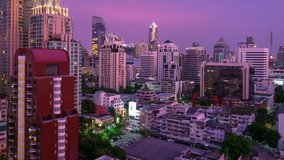Timelapse of the city of Bangkok at sunset, Thailand. Day to night smooth timelapse transition with skyscrapers of Bangkok. Zoom out version of the clip
