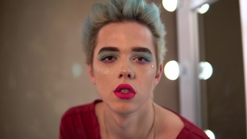 homosexual man with make up transvestite, travesti diva show, close up bright make up