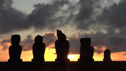 Low clouds float on statues on Easter Island.
