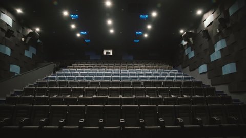 empty modern cinema with silver screen plenty of seats modern design