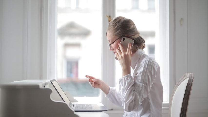 young woman works with computer 
 at home