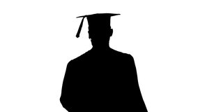 Silhouette Young graduate student in medical mask using phone walking. - Powered by Shutterstock - Get 15% off with code: PIKWIZARD15