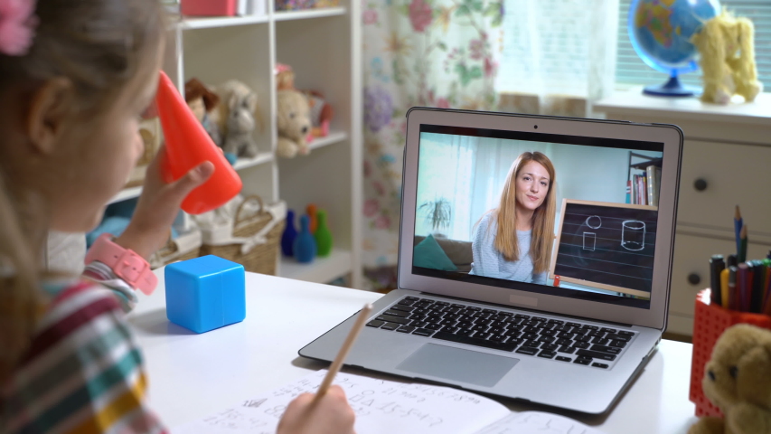 Young woman distance teacher online tutor conferencing on laptop communicate with pupil by webcam video call e-learning. Home quarantine distance learning and working at home. Royalty-Free Stock Footage #1051441402