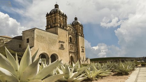 Mexico, Santo Domingo church in Oaxaca, time lapse, agave in the foreground, clouds running,
