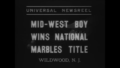 CIRCA 1937 - A Midwestern boy wins a national championship of playing marbles in Wildwood, New Jersey.