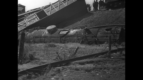 CIRCA 1936 - Wreckage of a cattle train crash is seen in Alexander, New York, and cattle are hauled to safety.