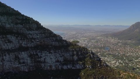 CAPE TOWN, SOUTH AFRICA - CIRCA 2010s - An aerial view shows the city behind the Lion's Head mountain in Cape Town, South Africa.