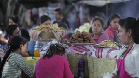 ANTIGUA, GUATEMALA - CIRCA 2010s - Busy food stalls serve meals to people attending Easter festivities (Semana Santa) in Antigua Guatemala.