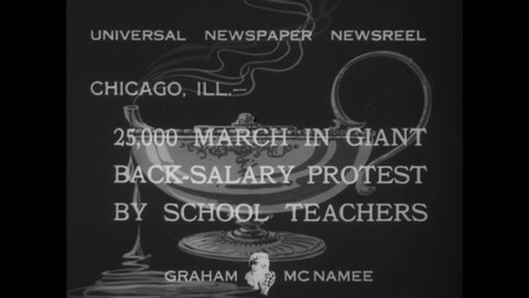 CIRCA 1933 - Teachers take to the streets of Chicago, Illinois for a huge protest demanding back-salary they are owed.