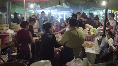 ANTIGUA, GUATEMAL - CIRCA 2010s - Busy food stalls serve meals to people attending Easter festivities (Semana Santa) in Antigua Guatemala.