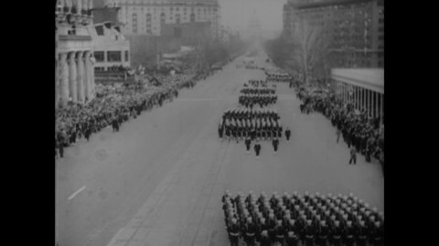 CIRCA 1933 - US Navy sailors march and a cavalry band plays down Pennsylvania Avenue in Washington DC for FDR's inaugural parade.