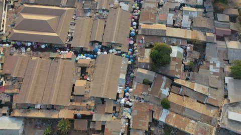 WEST AFRICA - CIRCA 2020 - aerial over West African street market in Gambia passes for Guinea, Bissau, Sierra Leone, Nigeria, Ivory Coast or Liberia.