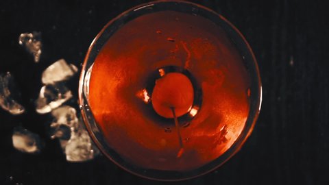 Red cocktail with cherry. Top view
