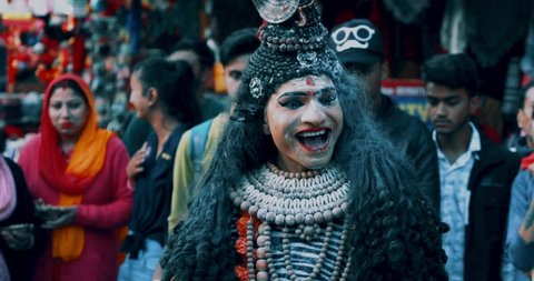 NAINITAL, INDIA - MARCH 04, 2019:A artist performing lord shiva tandav during shivratri on streets of Nainital. Shiva Tandav Stotram is a stotra (Hindu hymn) that describes Shiva's power and beauty.