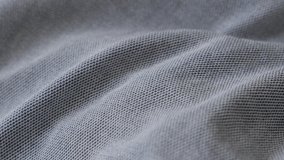 Finest details on modern shirt material 4K panning video