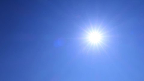 Solar energy power concept TimeLapse of natural bright sun light ray, sunbeams & flares shining on sunny clear blue sky background in tropical summer or spring midday sunlight at daylight sunshine day